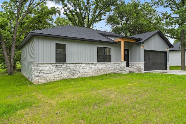 804 Iris Ave, Crane, MO 65633 - view of front of property featuring stone siding, an attached garage, a shingled roof, and a front yard