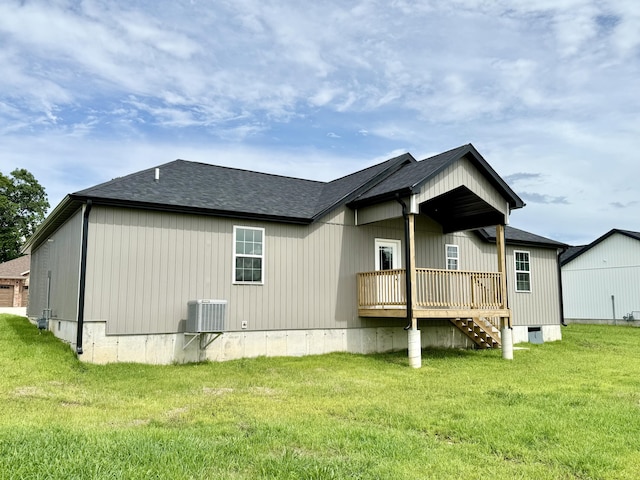 2605 Country Dr, Mountain Grove, MO 65711 - back of property featuring a lawn, a shingled roof, a deck, and stairs