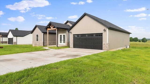 2605 Country Dr, Mountain Grove, MO 65711 - view of front facade featuring stone siding, a front yard, an attached garage, and concrete driveway