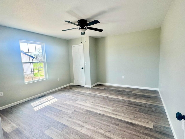 2605 Country Dr, Mountain Grove, MO 65711 - unfurnished room with wood finished floors and ceiling fan