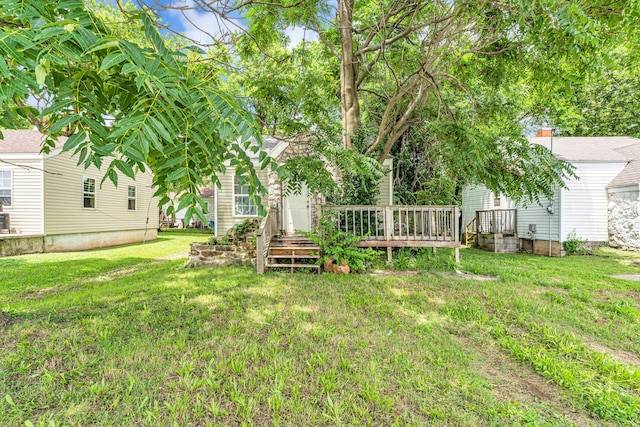 1673 E Chestnut St, Springfield, MO 65802 - view of grassy yard featuring a wooden deck