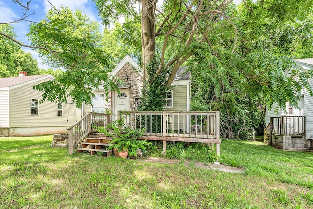 1673 E Chestnut St, Springfield, MO 65802 - view of green lawn featuring a wooden deck