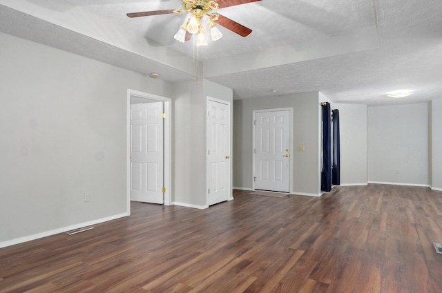 2606 S Overbrook Ave, Springfield, MO 65807 - empty room featuring dark wood-style flooring, ceiling fan, and a textured ceiling