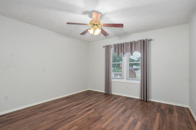2606 S Overbrook Ave, Springfield, MO 65807 - unfurnished room with dark wood finished floors and ceiling fan
