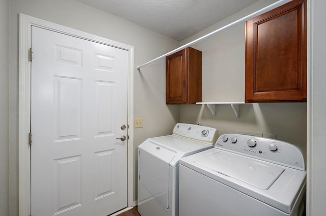 2606 S Overbrook Ave, Springfield, MO 65807 - washroom with washing machine and clothes dryer, cabinet space, and a textured ceiling