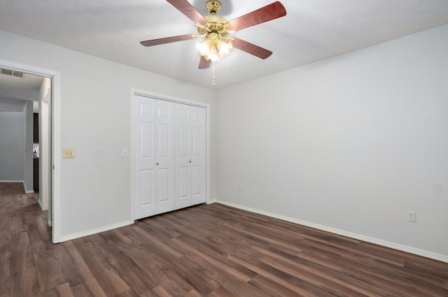 2606 S Overbrook Ave, Springfield, MO 65807 - unfurnished bedroom featuring dark wood-type flooring, a closet, and a ceiling fan