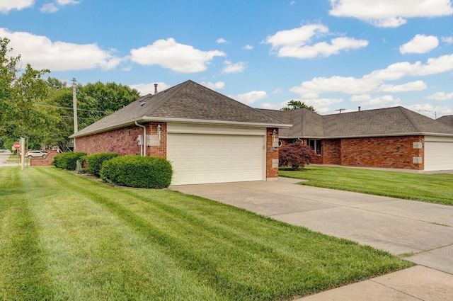 2606 S Overbrook Ave, Springfield, MO 65807 - ranch-style home with brick siding, a front lawn, and an attached garage
