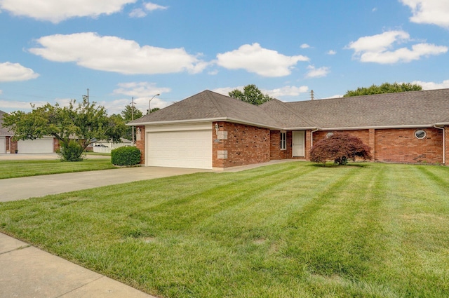 2606 S Overbrook Ave, Springfield, MO 65807 - ranch-style house featuring brick siding, a garage, concrete driveway, and a front yard