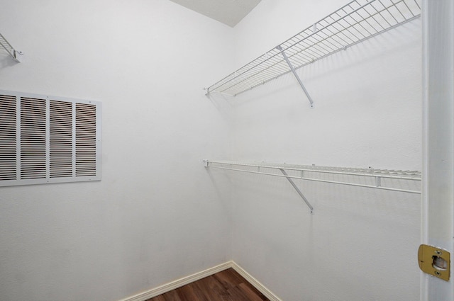 2606 S Overbrook Ave, Springfield, MO 65807 - spacious closet featuring dark wood finished floors