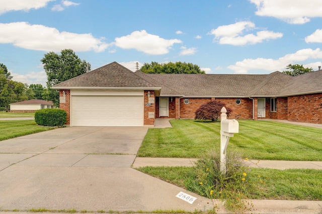 2606 S Overbrook Ave, Springfield, MO 65807 - ranch-style home with an attached garage, a front yard, and brick siding