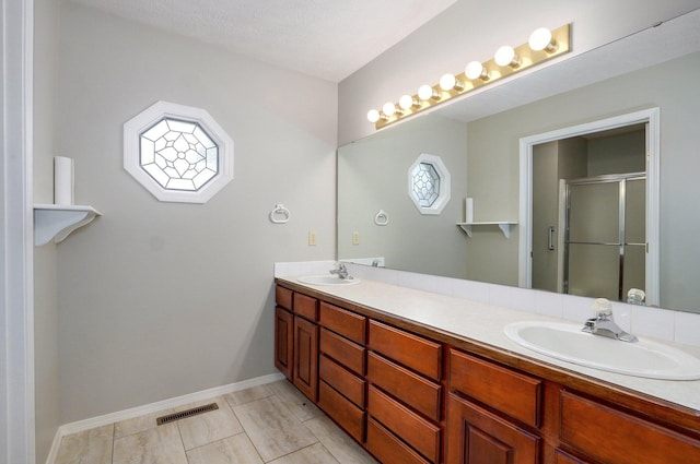 2606 S Overbrook Ave, Springfield, MO 65807 - full bathroom featuring double vanity and a stall shower