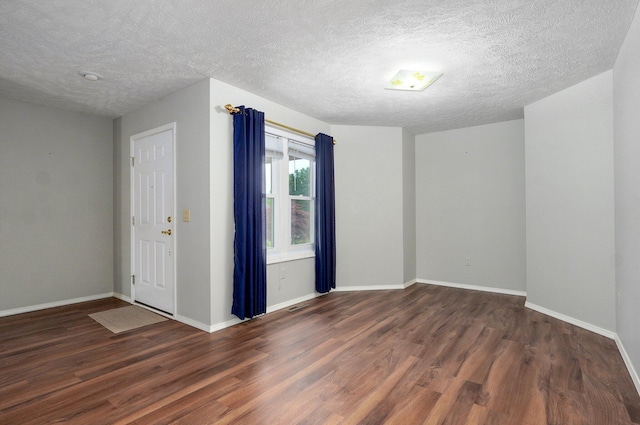 2606 S Overbrook Ave, Springfield, MO 65807 - spare room featuring wood finished floors and a textured ceiling