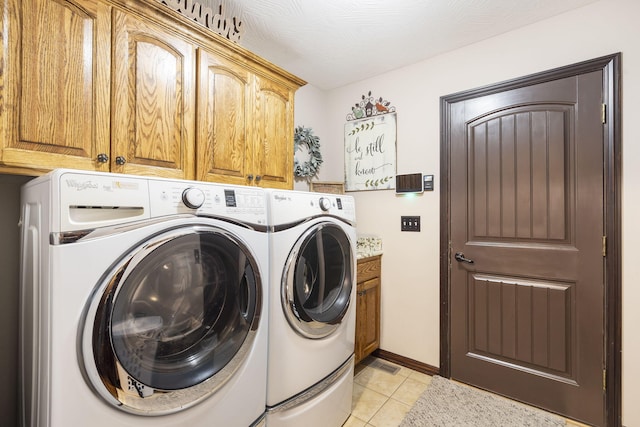 417 Panorama Dr, Cape Fair, MO 65624 - laundry room with cabinet space, washing machine and dryer, and light tile patterned flooring
