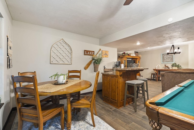 417 Panorama Dr, Cape Fair, MO 65624 - dining space with bar with sink, dark wood-type flooring, pool table, a chandelier, and recessed lighting