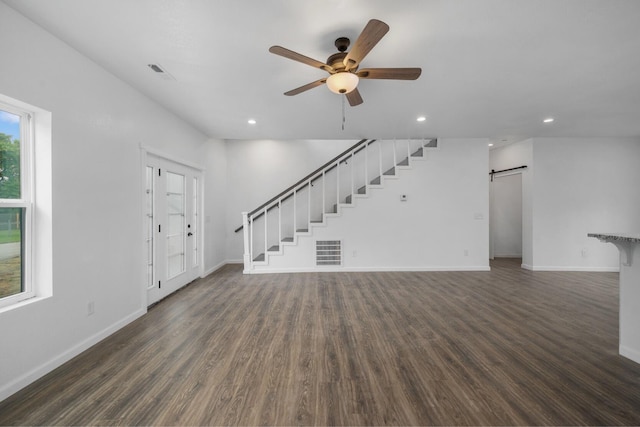 503 Valley View St, Carl Junction, MO 64834 - unfurnished living room with a barn door, ceiling fan, dark wood-type flooring, recessed lighting, and stairway