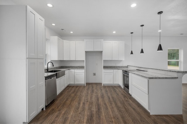 503 Valley View St, Carl Junction, MO 64834 - kitchen featuring appliances with stainless steel finishes, a peninsula, dark wood-type flooring, light stone countertops, and recessed lighting