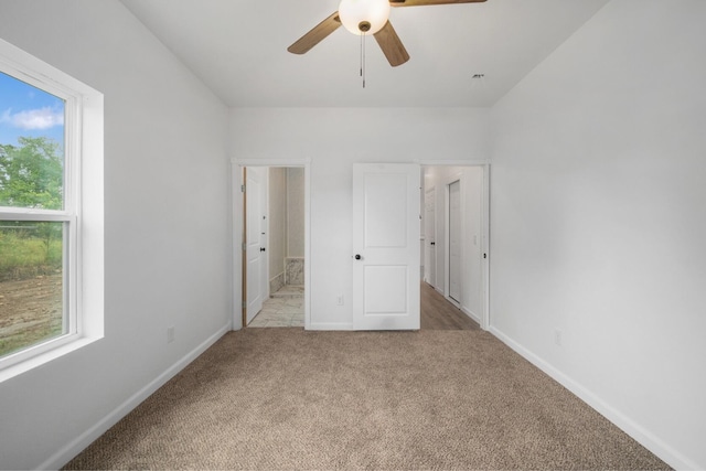 503 Valley View St, Carl Junction, MO 64834 - unfurnished bedroom with multiple windows, carpet, and ceiling fan
