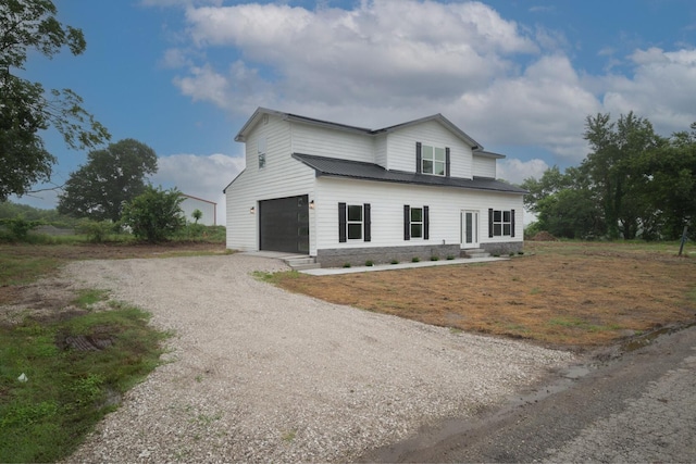503 Valley View St, Carl Junction, MO 64834 - view of front of house featuring driveway and a garage