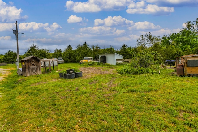 4216 Skyline Rd, Seymour, MO 65746 - view of yard featuring a storage unit and exterior structure