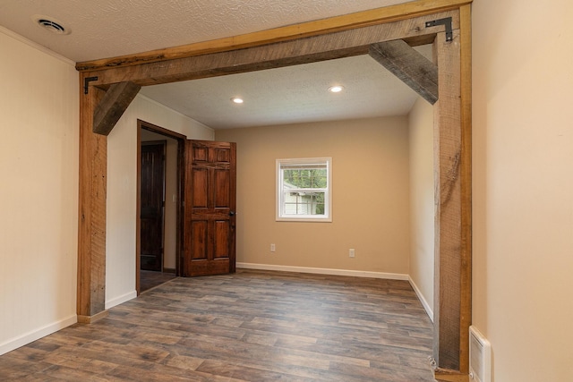311 College St, Crane, MO 65633 - empty room with dark wood-type flooring, recessed lighting, and a textured ceiling