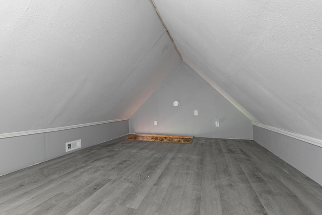 311 College St, Crane, MO 65633 - bonus room featuring lofted ceiling and wood finished floors