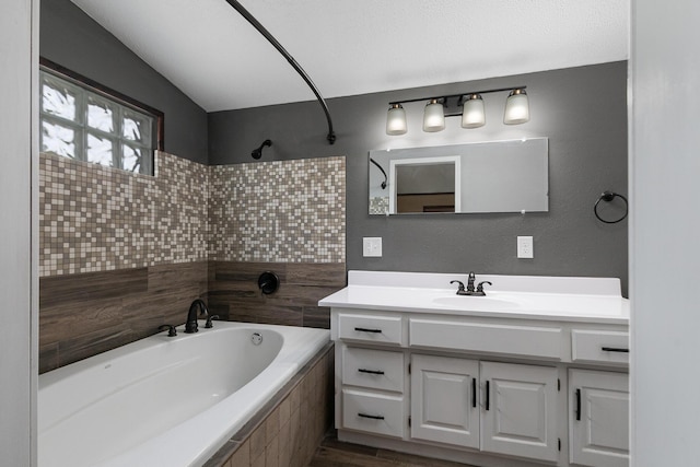 311 College St, Crane, MO 65633 - full bathroom with vanity, tiled shower / bath, and wood finished floors