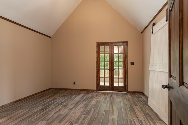 311 College St, Crane, MO 65633 - doorway featuring french doors, wood finished floors, a barn door, and high vaulted ceiling