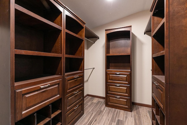 311 College St, Crane, MO 65633 - spacious closet with vaulted ceiling and light wood-style floors