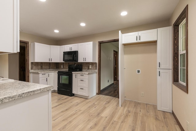 311 College St, Crane, MO 65633 - kitchen featuring black appliances, light countertops, white cabinets, light wood finished floors, and recessed lighting
