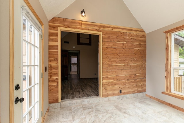 311 College St, Crane, MO 65633 - unfurnished room with lofted ceiling and wooden walls
