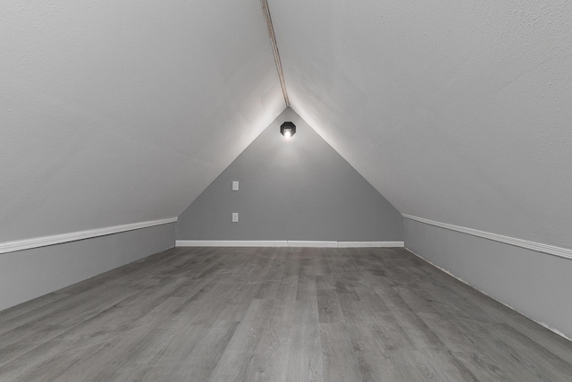 311 College St, Crane, MO 65633 - bonus room with vaulted ceiling and wood finished floors