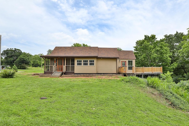 311 College St, Crane, MO 65633 - back of house with a sunroom, a lawn, and a wooden deck