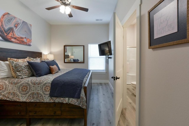 280 Lakefront Dr, Branson, MO 65616 - bedroom featuring wood finished floors, a ceiling fan, and connected bathroom