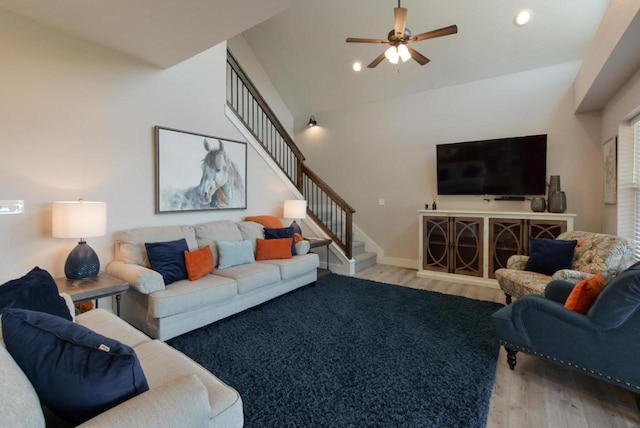 280 Lakefront Dr, Branson, MO 65616 - living room with wood finished floors, stairs, a ceiling fan, vaulted ceiling, and recessed lighting