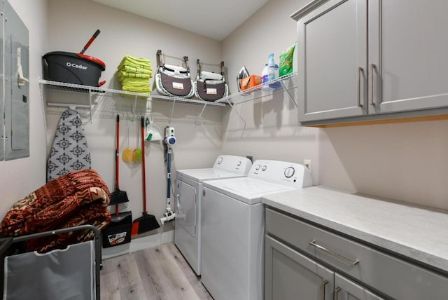 280 Lakefront Dr, Branson, MO 65616 - washroom with cabinet space, washing machine and dryer, light wood-type flooring, and electric panel