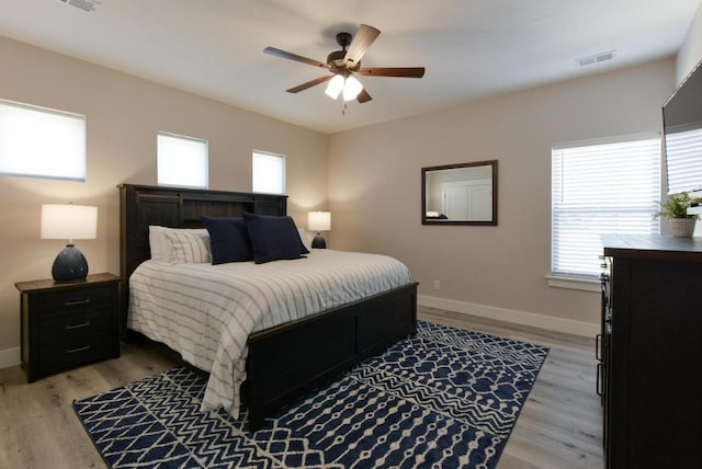 280 Lakefront Dr, Branson, MO 65616 - bedroom featuring multiple windows, light wood-type flooring, and ceiling fan