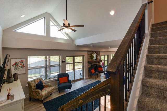 280 Lakefront Dr, Branson, MO 65616 - living room with wood finished floors, a ceiling fan, stairs, recessed lighting, and a stone fireplace