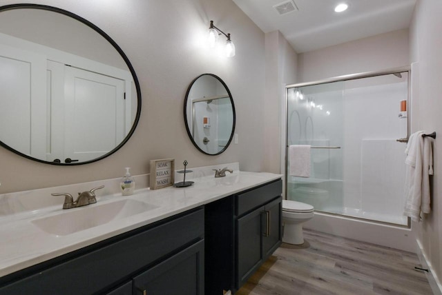 280 Lakefront Dr, Branson, MO 65616 - bathroom with wood finished floors, double vanity, a shower stall, and recessed lighting