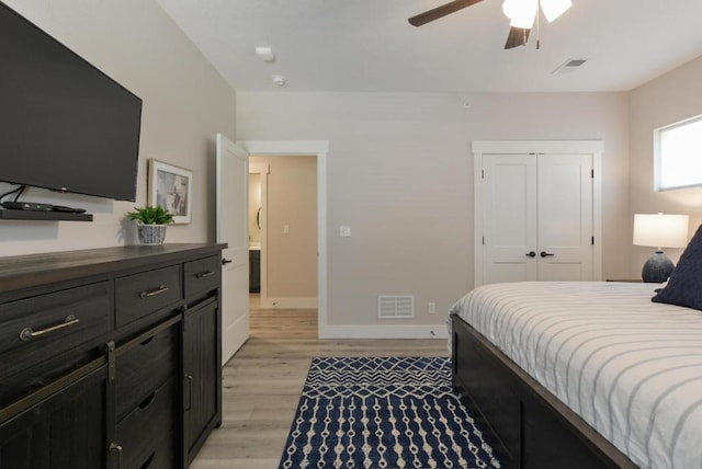 280 Lakefront Dr, Branson, MO 65616 - bedroom with light wood finished floors, a closet, and ceiling fan