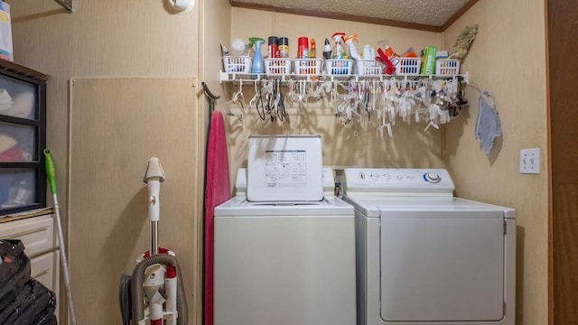 167 Timber Valley Rd, Mammoth Spring, AR 72554 - washroom featuring washing machine and clothes dryer and a textured ceiling