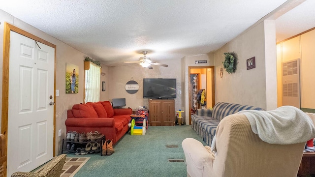 167 Timber Valley Rd, Mammoth Spring, AR 72554 - living area featuring carpet flooring, a heating unit, a ceiling fan, and a textured ceiling