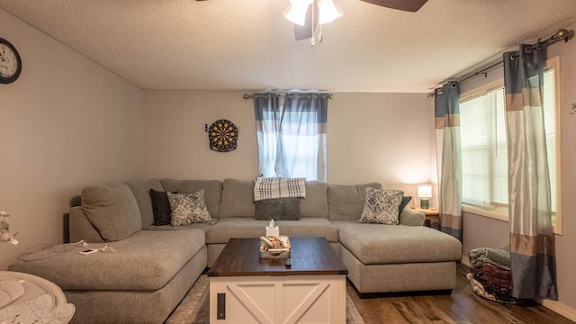 185 Timber Valley Rd, Mammoth Spring, AR 72554 - living area featuring a textured ceiling, wood finished floors, and a ceiling fan