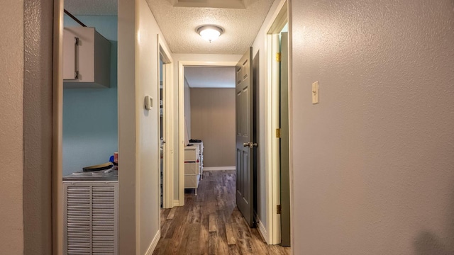 185 Timber Valley Rd, Mammoth Spring, AR 72554 - corridor with wood finished floors and a textured ceiling
