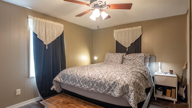 185 Timber Valley Rd, Mammoth Spring, AR 72554 - bedroom featuring wood finished floors, a ceiling fan, and a decorative wall