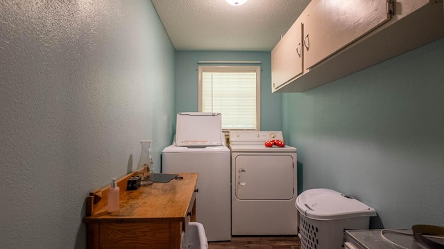 185 Timber Valley Rd, Mammoth Spring, AR 72554 - laundry area featuring cabinet space, washer and clothes dryer, a textured wall, dark wood finished floors, and a textured ceiling