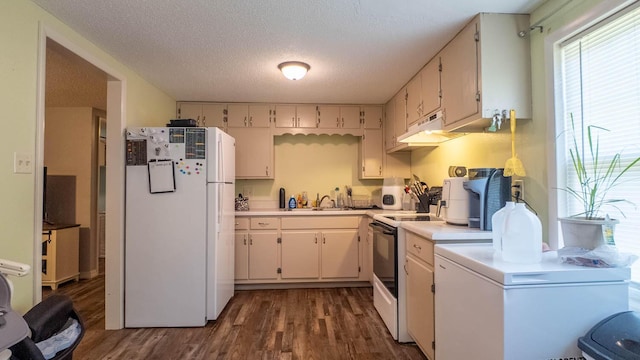 185 Timber Valley Rd, Mammoth Spring, AR 72554 - kitchen featuring freestanding refrigerator, range with electric cooktop, dark wood-style flooring, light countertops, and under cabinet range hood