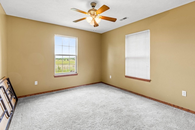 107 W Summit St, Aurora, MO 65605 - empty room with carpet and ceiling fan