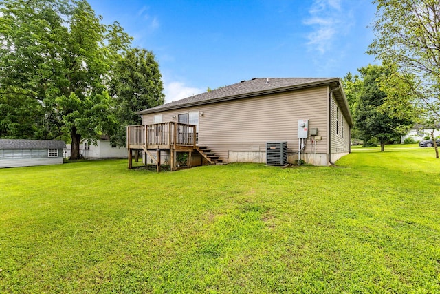 107 W Summit St, Aurora, MO 65605 - rear view of house featuring stairs, a deck, and a yard