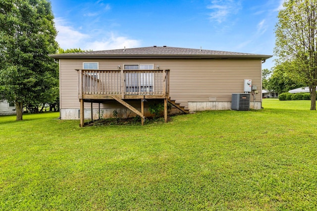 107 W Summit St, Aurora, MO 65605 - rear view of house featuring a deck, a yard, and stairway