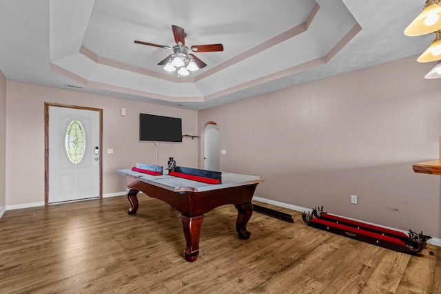 107 W Summit St, Aurora, MO 65605 - playroom featuring a raised ceiling, wood finished floors, a ceiling fan, and arched walkways